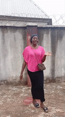 Woman in pink top observed standing in Rido, Nigeria