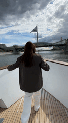 Woman enjoys champagne boat ride on Moscow river