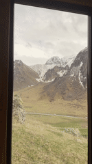 Mountain view captured through window in Pkhelshe, Georgia