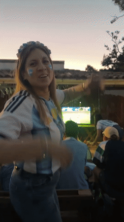 Argentina fans celebrate a soccer match in Búzios at night