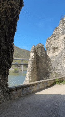 Tourist explores dramatic cliff formations in Asparuhovo, Bulgaria