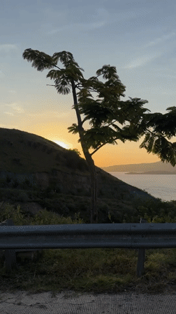 Sunset captured over water from road in Indonesia