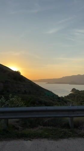 Sunset captured over water from road in Indonesia
