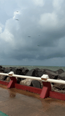 Ocean pier with striped barriers documented in Allende, Mexico