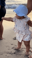 Family enjoys morning beach time in North Kuta, Indonesia