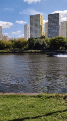 Sunny morning around Khimki's waterfront, fountains, and skyline