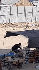 Daily life continues across a Khan Yunis displacement camp