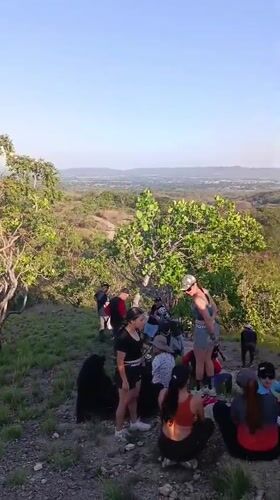 Mountain biking group gathers at hilltop cross in Tinaquillo