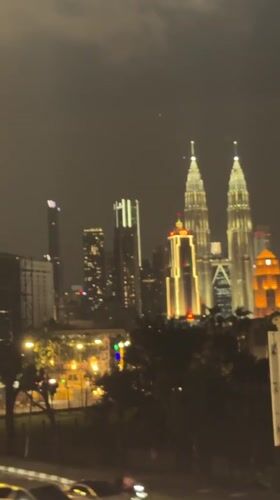 Kuala Lumpur at night, Petronas Towers glowing over the city
