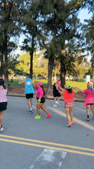 Street dancers in neon clothing perform in Buenos Aires