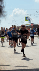 Marathon runners race through Izhevsk streets on sunny morning