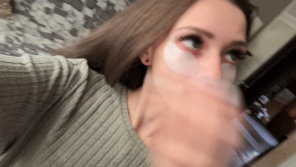 Woman applies skincare patches in gaming chair, Reutov