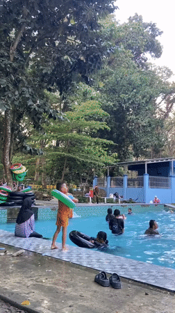 Busy family swim day at Mlowokarangtalun public pool