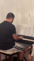 Keyboard practice session in a Markham room, sheet music open