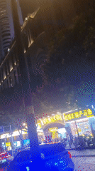 Vibrant nighttime street scenes captured in Yuzhong District commercial area