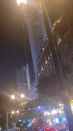 Vibrant nighttime street scenes captured in Yuzhong District commercial area