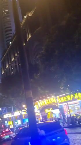 Vibrant nighttime street scenes captured in Yuzhong District commercial area