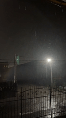 Rainy night scene captured in Hatne, Ukraine