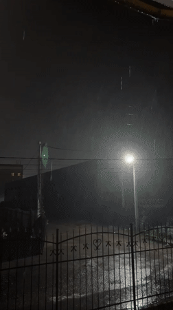 Rainy night scene captured in Hatne, Ukraine