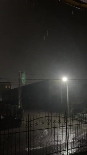 Rainy night scene captured in Hatne, Ukraine