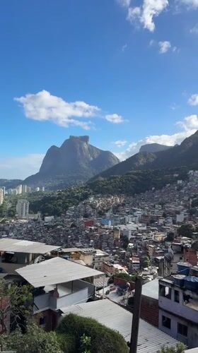 Aerial footage captures Rio favela panorama during evening hours