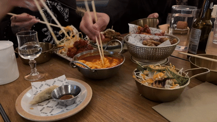 Evening Korean dinner shared by friends in London restaurant