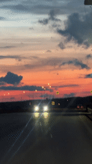Dashboard cameras capture sunset highway drive across bridges