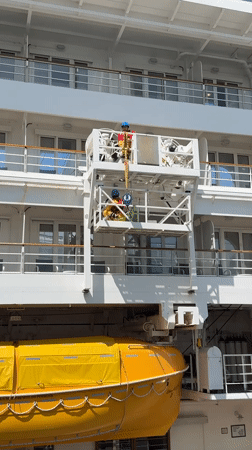 Ship maintenance crew works on cruise vessel platform Vancouver