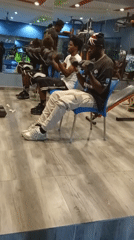 Group dumbbell curl session at a gym in Akwanga, Nigeria