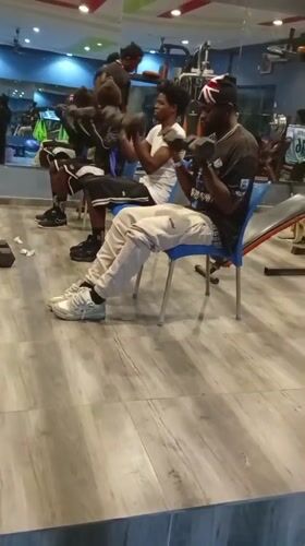 Group dumbbell curl session at a gym in Akwanga, Nigeria