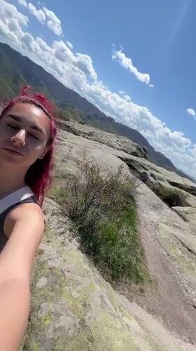 Tourist documents scenic mountain visit at Sini Vrah Bulgaria