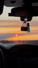 Driver travels with baby during sunset in Vyselki, Russia