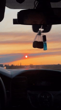 Driver travels with baby during sunset in Vyselki, Russia