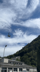Cable cars, street performers, and alpine scenery in a European city