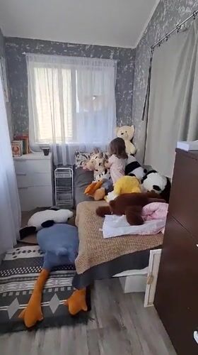 Toddler plays with panda stuffed animals during morning playtime