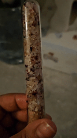 Test tubes with layered materials observed in Trier