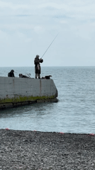 Overcast beach day brings windsurfers, sunbathers to Sochi coast