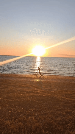 Golden hour brings families to Shchelkino waterfront for evening activities