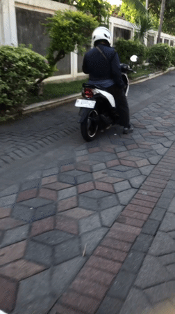 Everyday motorcycle traffic through Boro, East Java