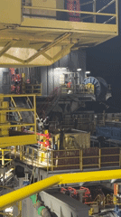 Offshore drilling rig operations documented at night in Italian waters