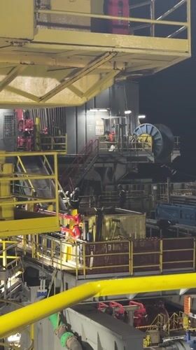 Offshore drilling rig operations documented at night in Italian waters