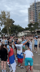 Youth group celebrates on basketball court in Budva, Montenegro