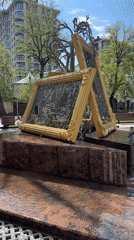 Children play at urban fountain as teens gather nearby