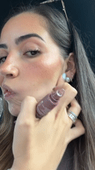 Woman applies makeup in parked car on Puebla street