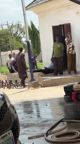 Daily commerce and car services documented in Nigerian village