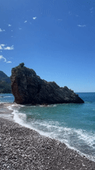 Tranquil coastal scene captured with rock formation and turquoise waters