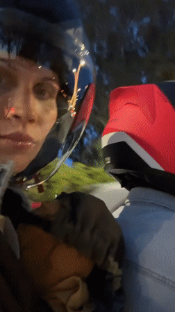 Woman films motorcycle ride while carrying child in Fethiye