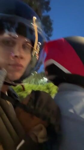 Woman films motorcycle ride while carrying child in Fethiye