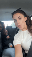 Three women photographed together in car in Tel Aviv