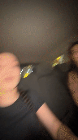 Two women travel by car through Giza at night